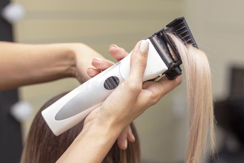 Hair Polishing Procedure. the Hairdresser in the Salon Polishes the Hair  with a Special Machine for Polishing Hair Stock Photo - Image of healthy,  polishing: 164794748