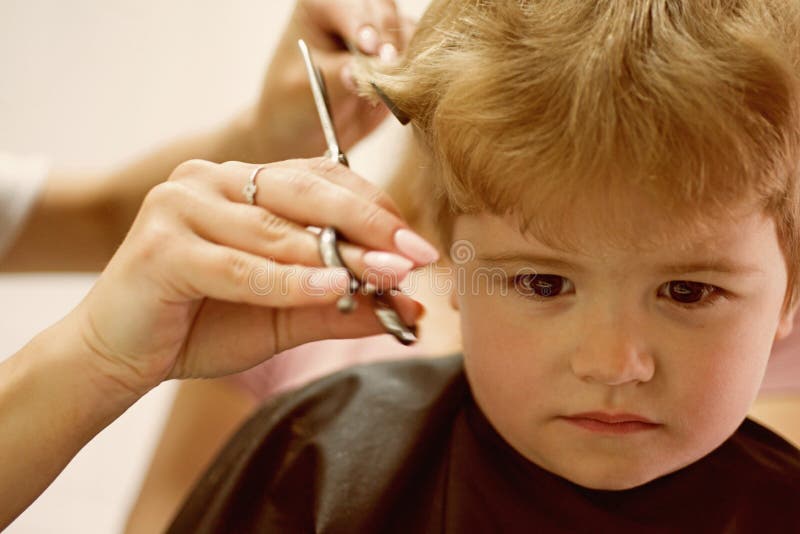 hair salon specializes toddlers little boy blond hair hairdresser small child hairdressing salon cute boys hair 137847842