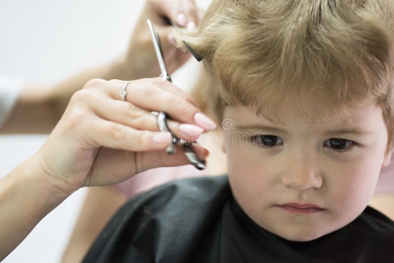 Hair Salon that Specializes in Toddlers. Little Boy with Blond Hair at  Hairdresser Stock Photo - Image of haircare, cutting: 130436454