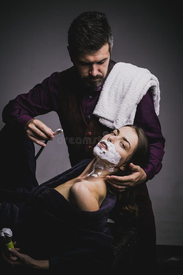 barbers wife shaving in barbershop