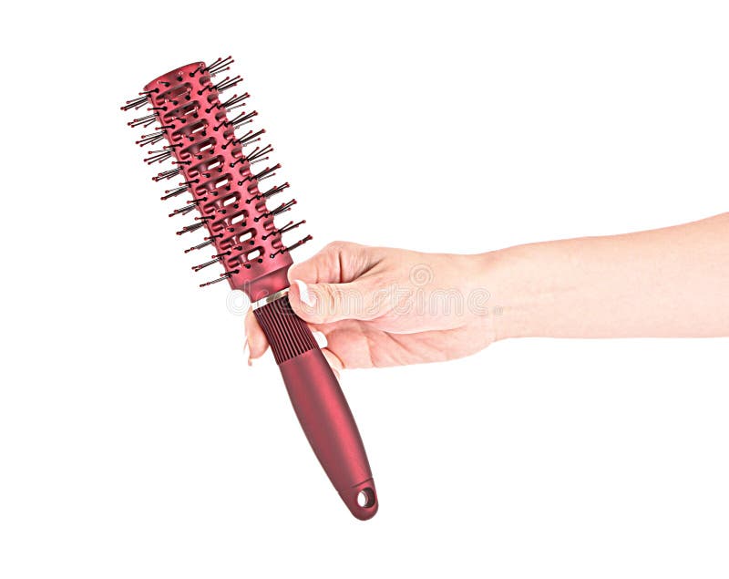 Hairbrush in hand isolated stock image. Image of comb 16199161