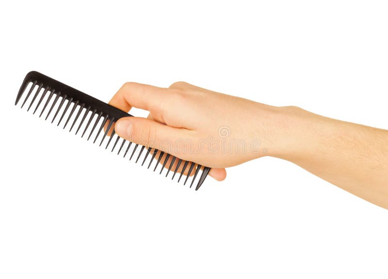 Hairbrush in the hand royalty free stock photography