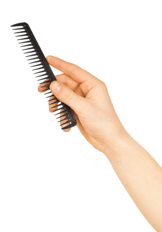 Hairbrush in the hand stock photography