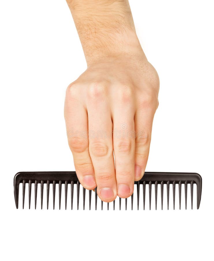 Hairbrush in a man's hand royalty free stock photo