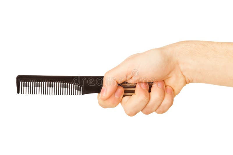 Hairbrush in a man's hand royalty free stock photo