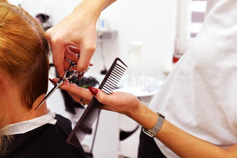 A haircut. short haircut and styling. picture in the cabin. the work of the master barber royalty free stock photography A haircut. short haircut and styling. picture in the cabin. the work of the master barber royalty free stock photography