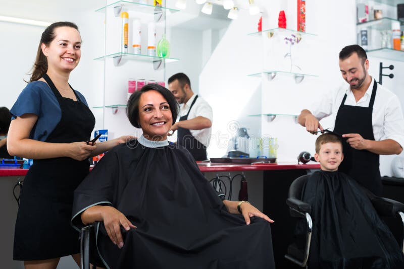 Hairdresser Chatting with Her Client, Killing Time while Hair Bleaching ...