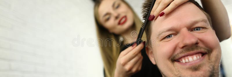 Hairdresser Combing Male Hair in Beauty Salon royalty free stock photo Hairdresser Combing Male Hair in Beauty Salon royalty free stock photo