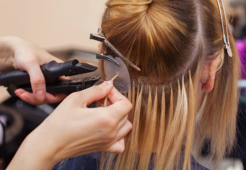 The Hairdresser Does Hair Extensions To a Young Girl, a Blonde in a Beauty Salon. Stock Image - Image of client, fashion: 138011233 The Hairdresser Does Hair Extensions To a Young Girl, a Blonde in a Beauty Salon. Stock Image - Image of client, fashion: 138011233
