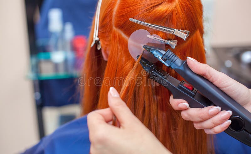 The Hairdresser Does Hair Extensions To a Young Redhead Girl in a Beauty  Salon. Professional Hair Care Stock Photo - Image of bundles, caucasian:  168032504
