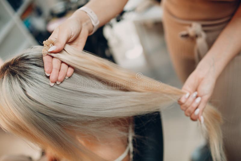 Hairdresser Female Making Hair Extensions To Young Woman with Blonde Hair in Beauty Salon. Professional Hair Extension Stock Image - Image of hairstyle, head: 212210463 Hairdresser Female Making Hair Extensions To Young Woman with Blonde Hair in Beauty Salon. Professional Hair Extension Stock Image - Image of hairstyle, head: 212210463