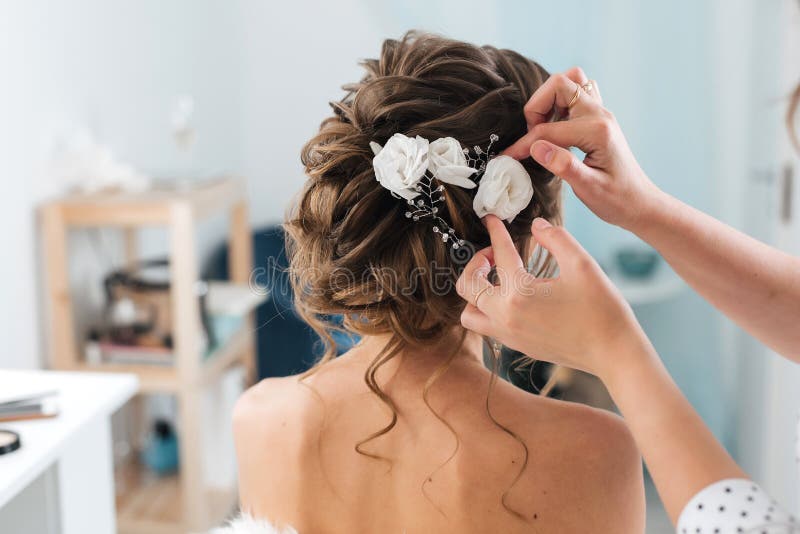 Hairdresser Makes an Elegant Hairstyle Styling Bride with White Flowers in  Her Hair Stock Image - Image of beautician, hairdressing: 165276947