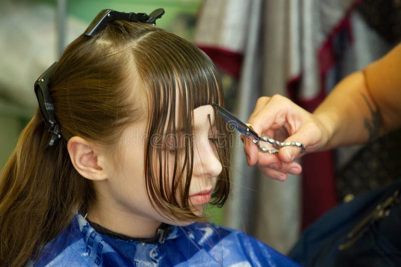 Hairdresser Making a Hair Style To Cute Little Girl Stock Photo - Image of  barber, female: 152415096