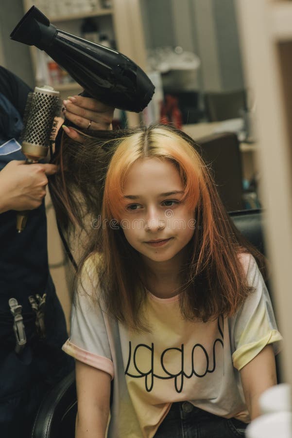 Hairdresser Making a Hair Style To Cute Little Girl. a Teenage Girl Has Her  Bangs Lightened in a Beauty Salon Stock Photo - Image of haircut, cute:  201158698