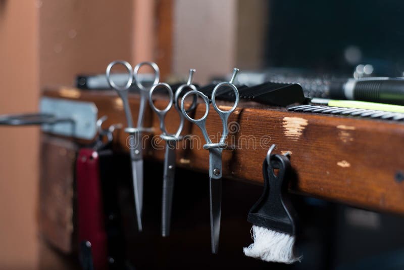 Hairdresser`s Workplace. a Set of Scissors, Combs, Nozzles for Cutting Hair  of a Machine, on a Wooden Table in a Barbershop Stock Image - Image of  action, decorate: 187234909