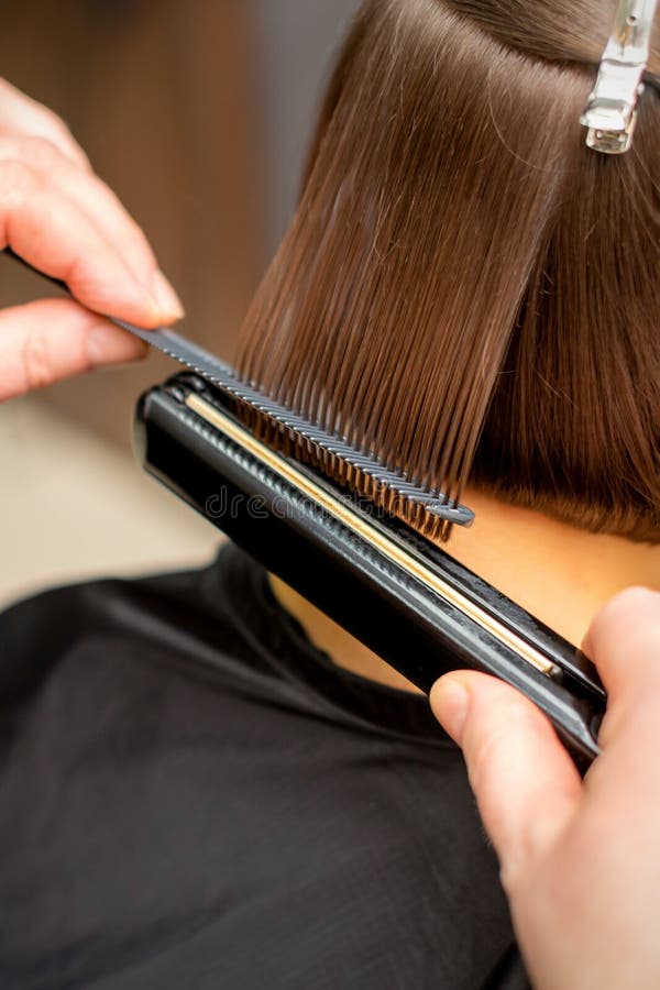 Hairdresser Straightening the Short Hair Stock Photo - Image of hand, care:  208254336