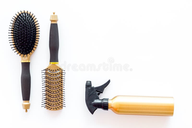 Hairdresser working desk with tools for hair styling on white desk background top view mock up