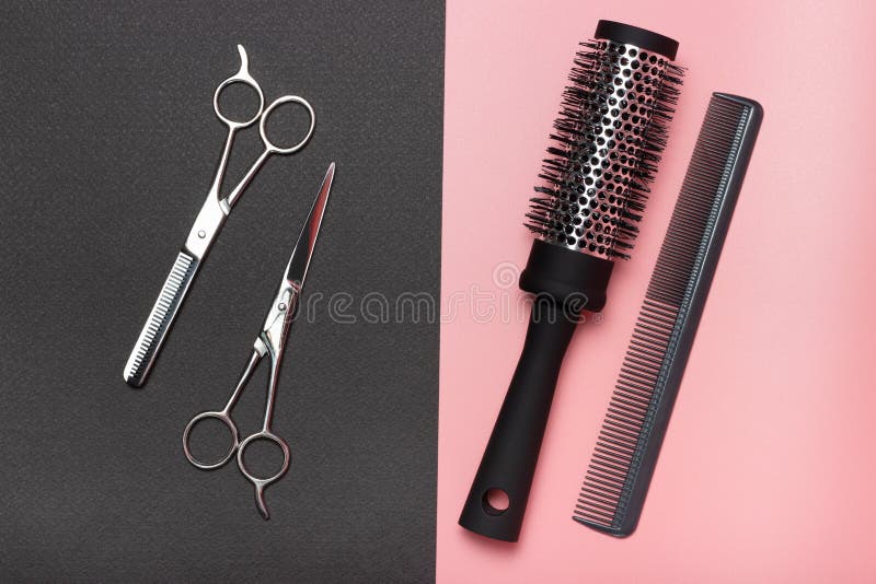 Hairdressing Scissors and Combs, on Black and Pink Background, a View
