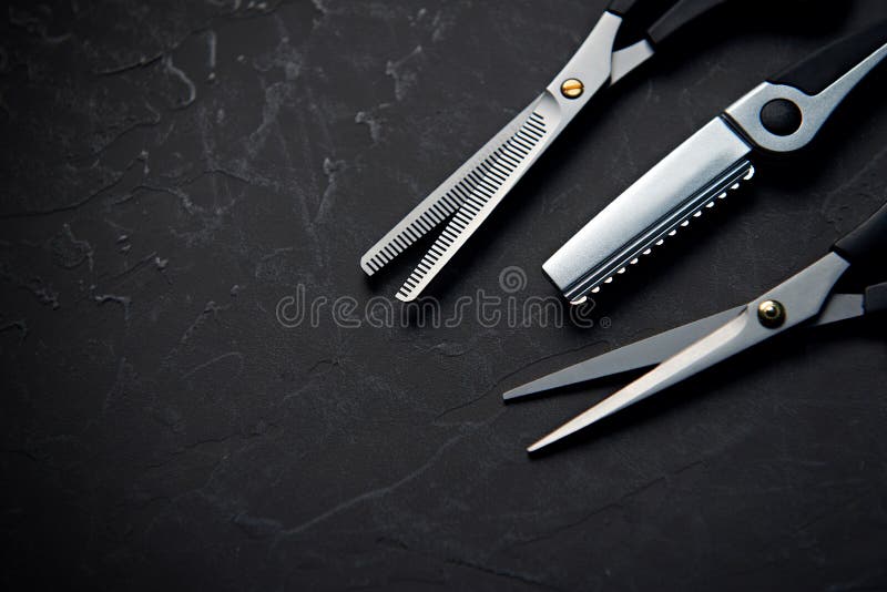 Hairdressing Tools On Black Background With Copy Space At Top