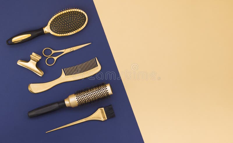 Hairdressing tools on a blue background and a yellow sheet with space for text. Gold hair salon accessories.