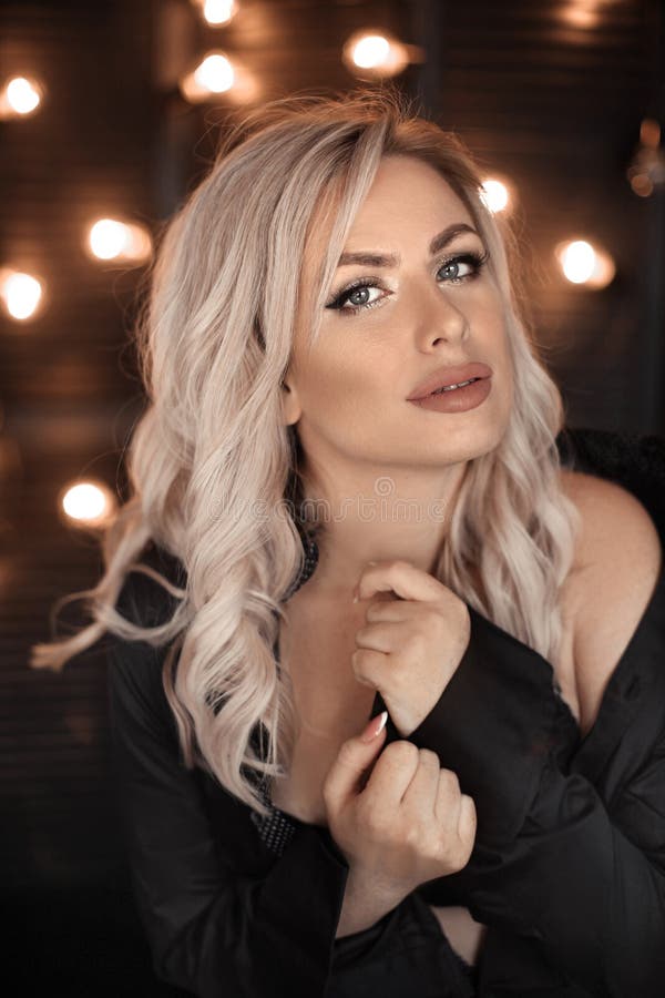 Hairstyle. Beautiful Blonde Woman Portrait Posing in Black Shirt Stock Image - Image of blonde, hand: 140397903 Hairstyle. Beautiful Blonde Woman Portrait Posing in Black Shirt Stock Image - Image of blonde, hand: 140397903