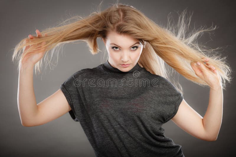 Blonde girl with wavy hair waving at the camera - wide 2