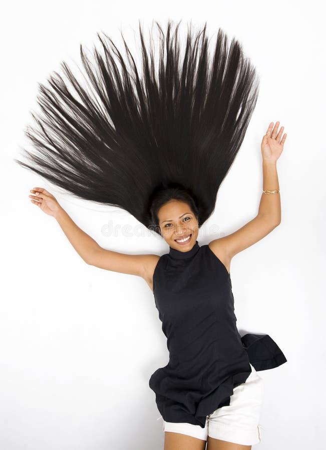 Young asian woman laying on the floor with her long hair spread out. Young asian woman laying on the floor with her long hair spread out