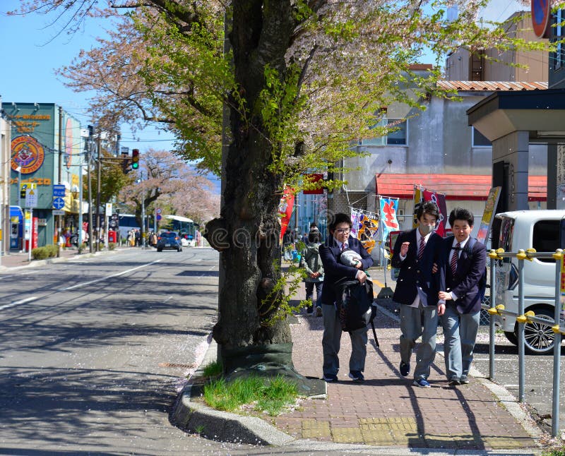 Highschool students playing on a sunny street royalty free stock photography