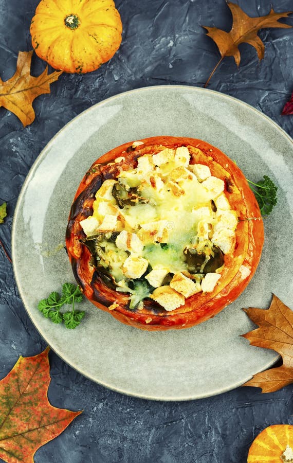 Stuffed Baked Pumpkin Filled With Cheese And Vegetables Stock Image stuffed-baked-pumpkin-filled-with-cheese-and-vegetables-stock-image