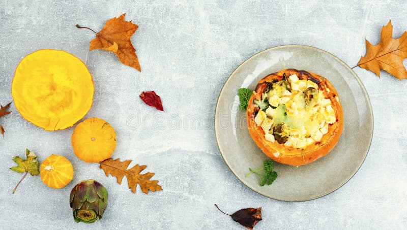 Stuffed Baked Pumpkin Filled With Cheese And Vegetables Stock Photo stuffed-baked-pumpkin-filled-with-cheese-and-vegetables-stock-photo