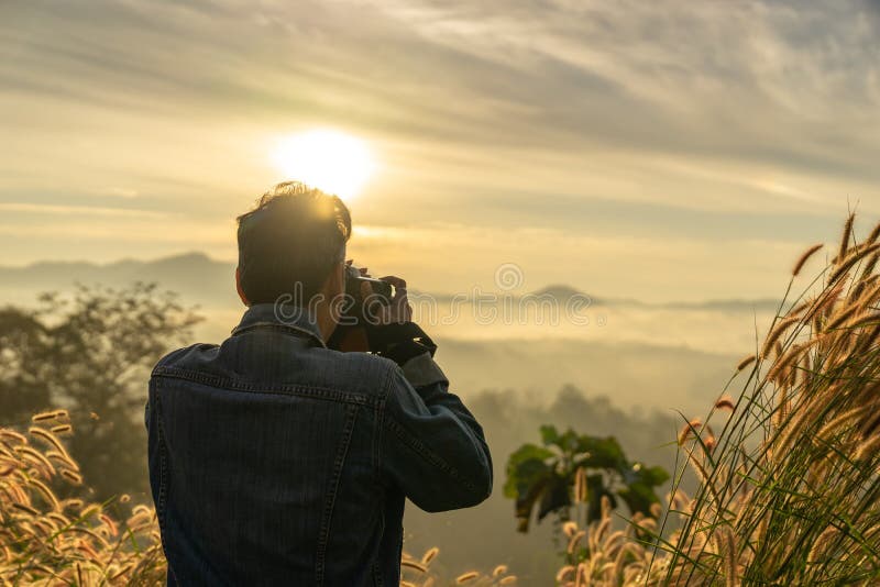 Close Up Back of a Caucasian Man Taking Photo of Foggy Mountain in Sunrise  Time Stock Photo - Image of natural, nature: 137223314