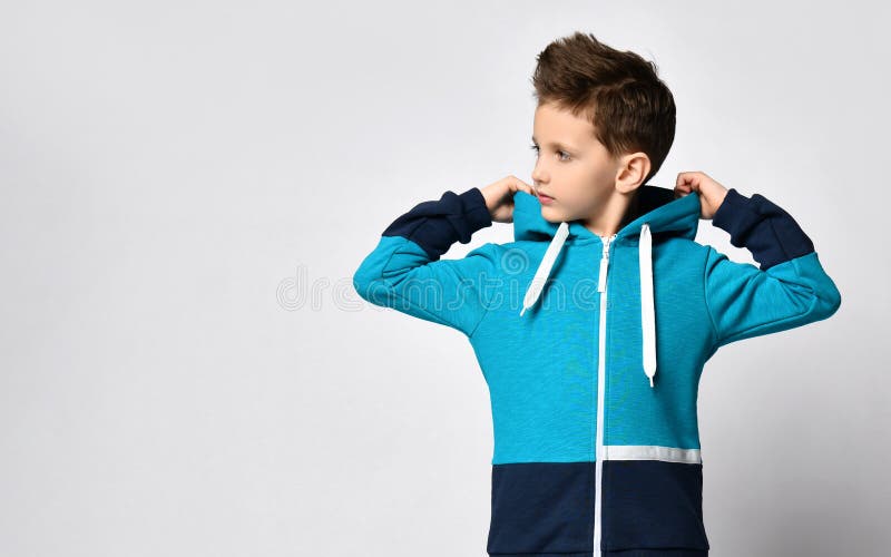 Boy Model in Sports Tracksuit Taking Off Hood Stock Photo - Image of ...