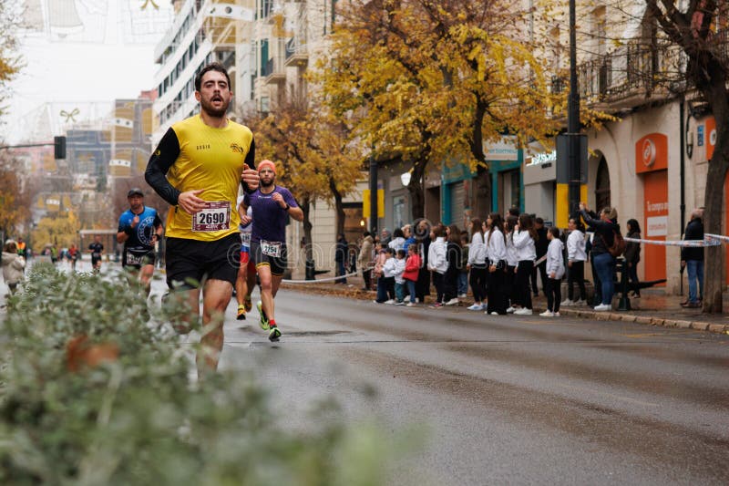 Half marathon runner passing through Camilo Sesto Avenue in Alcoy royalty free stock photo