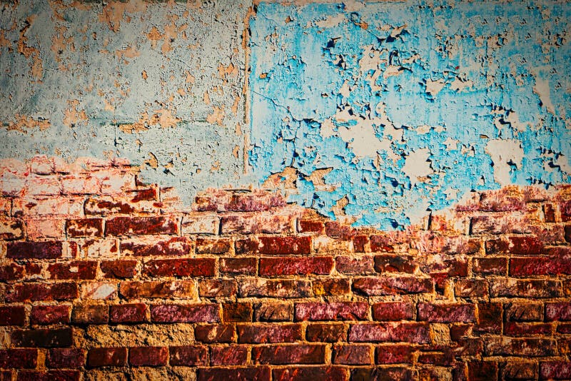 Home renovation. Half painted red brick wall with peeling blue worn paint, abandoned house. Frame for text. Home renovation. Half painted red brick wall with peeling blue worn paint, abandoned house. Frame for text