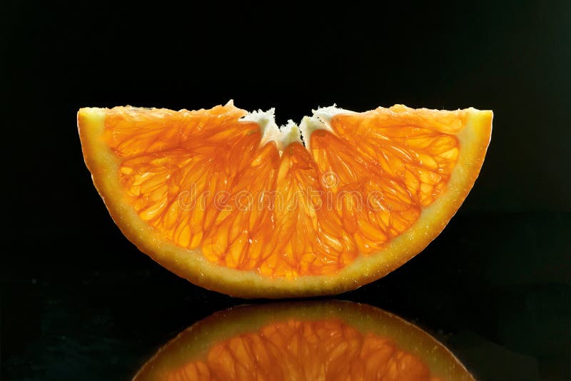 Half slices of Orange on a dark background stock images Half slices of Orange on a dark background stock images
