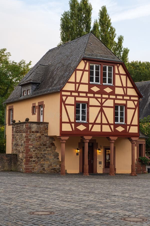 Beautiful old half-timbered house in the castle area of Vollrads / Germany in the evening light in the Rheingau. Beautiful old half-timbered house in the castle area of Vollrads / Germany in the evening light in the Rheingau