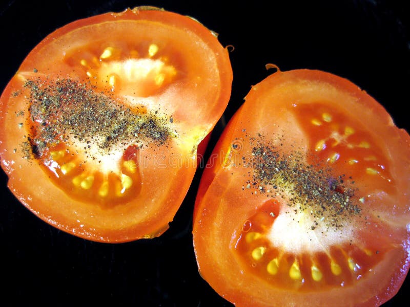 Half of tomato with pepper