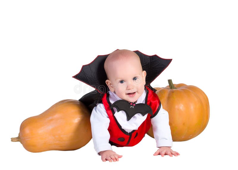 Halloween baby boy in dracula cloak with pumpking