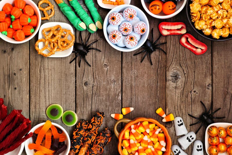 Halloween Candy Buffet Table Corner Border Over a Rustic Wood Background  with Copy Space Stock Photo - Image of delicious, candy: 157863794