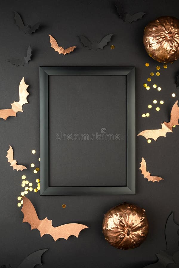 Halloween composition mock up. Black photo frame, flying black paper bats on purple background.