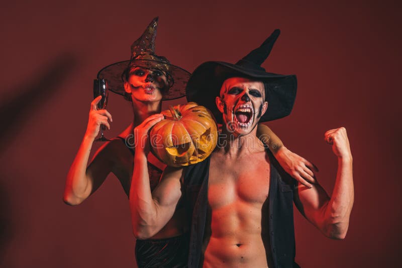 Halloween couple with makeup on shouting face hold pumpkin royalty free stock images Halloween couple with makeup on shouting face hold pumpkin royalty free stock images