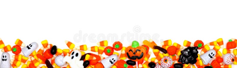 Halloween candy long border. Top view isolated on a white background. Halloween candy long border. Top view isolated on a white background.