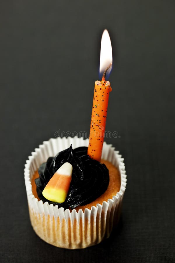 Halloween cupcake with lit candle