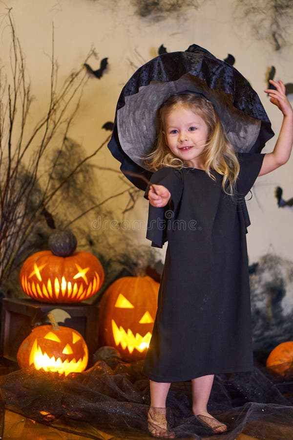 Halloween Cute Girl Dressed Witch with a Magic Wand. Pumpkins and ...