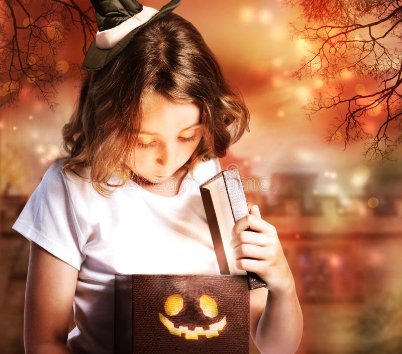 Halloween Cute Little Witch with Box stock photo Halloween Cute Little Witch with Box stock photo