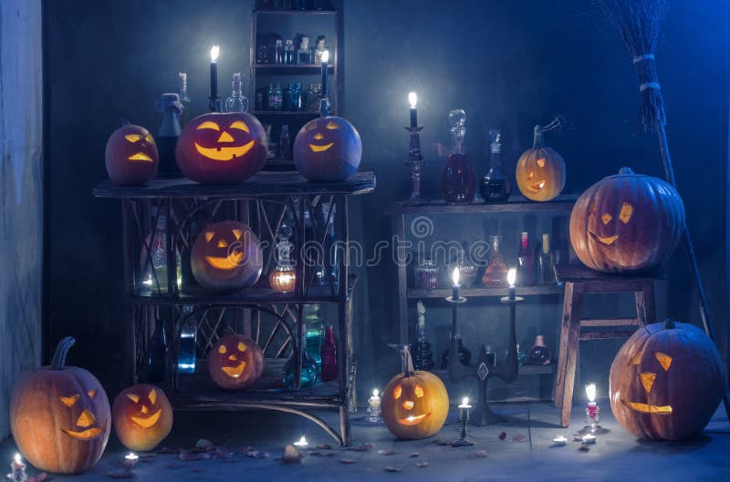 Halloween decoration with pumpkins and magic potions indoor