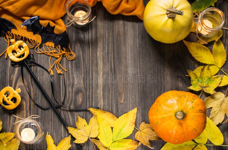 Halloween flat lay composition on wooden background with pumpkins, autumn leaves and candles stock photography Halloween flat lay composition on wooden background with pumpkins, autumn leaves and candles stock photography