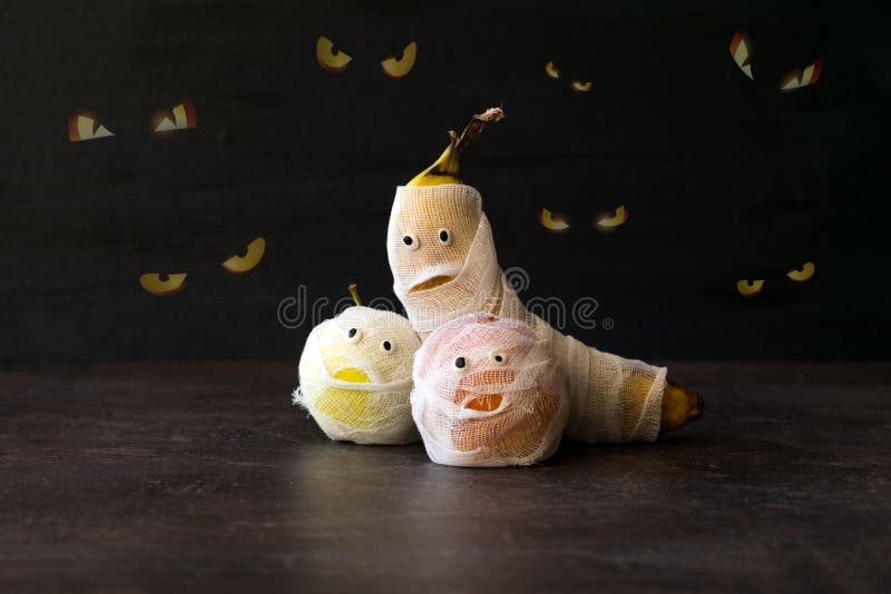 Halloween Fruit Mummy. Funny Scared orange, apple and banana wit royalty free stock photo Halloween Fruit Mummy. Funny Scared orange, apple and banana wit royalty free stock photo