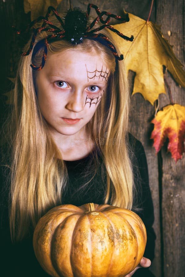 Halloween Girl with a Pumpkin Stock Photo - Image of mysterious, dark ...