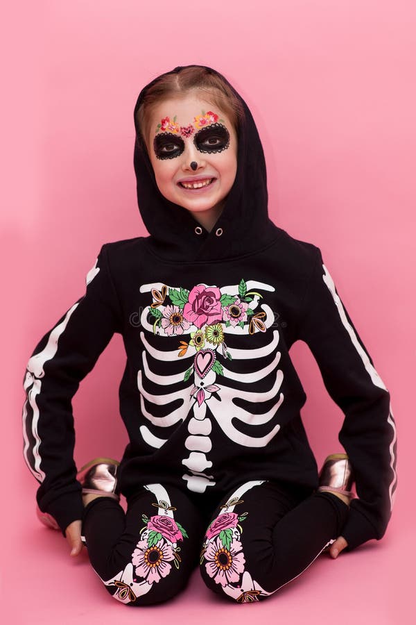 Halloween. The Girl In The Skeleton Costume. Pink Background. Stock ...